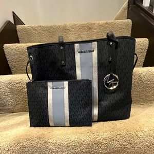 Michael Kors blue laptop bag with matching clutch. New with tags.